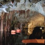 taking a boat ride on the subterranean river in the caves of Diros
