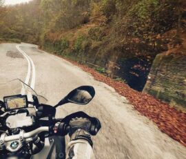 mountain road in Pelion, riding with MotoGreece POV rider view on motorcycle on twisty road