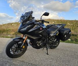 A black Honda NT1100 motorcycle parked