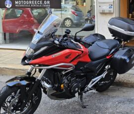 a Honda NC750X motorcycle rental parked in front of MotoGreece's office