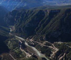 view of the road crossing Arachthos river valley in Tzoumerka, on tour with Motogreece drone view of view of the road crossing Arachthos river valley in Tzoumerka, on tour with Motogreece
