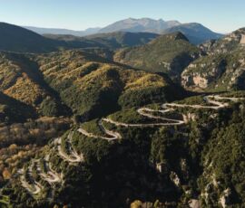 the switchbacks climbing to Papigo, drone view by MotoGreece